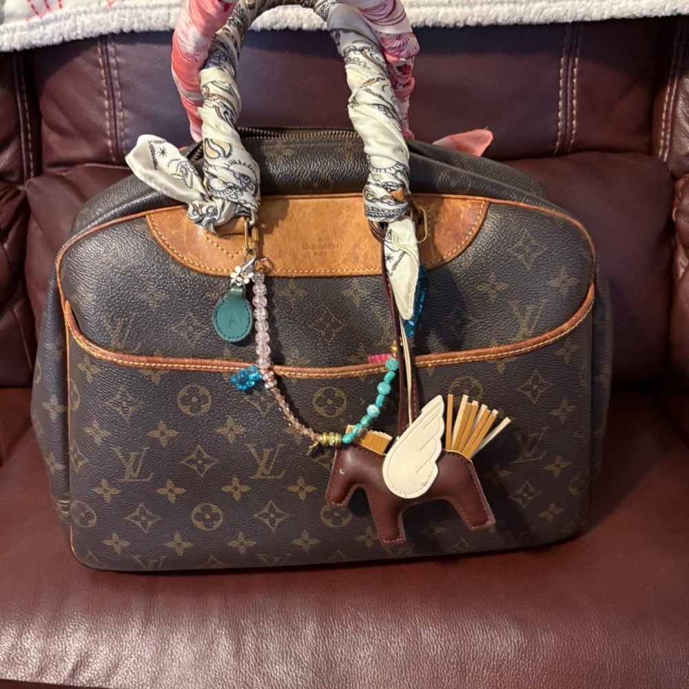 Brown Designer Handbag With Patterned Accents - image 1